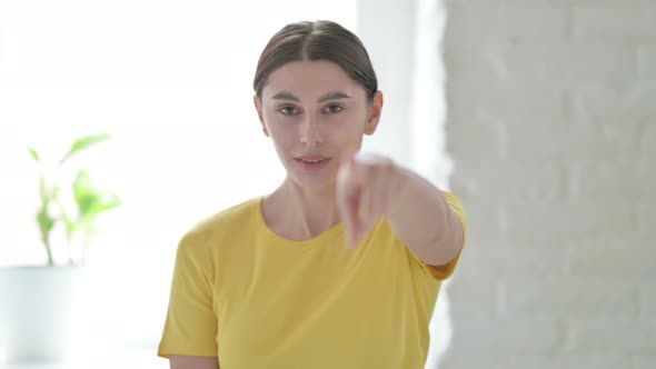 Portrait of Woman Pointing at the Camera