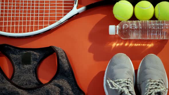 Water bottle, sports shoes and sports equipment in studio 4k