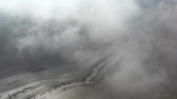 Flight Over A Dry Dam In The Autumn Foggy Day In The Morning 