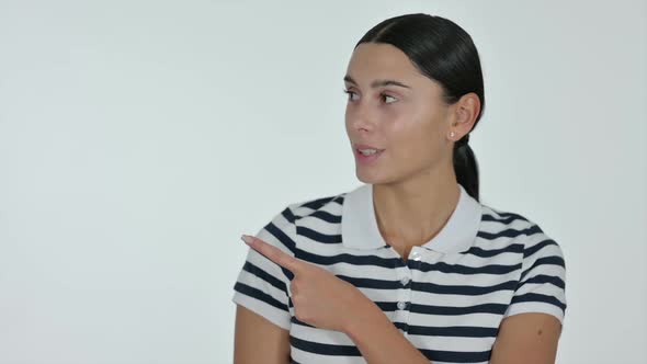 Latin Woman Pointing at Product with Finger White Background