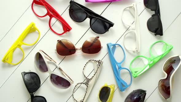 Collection of Various Style and Color Sunglasses and Frames Captured From Above