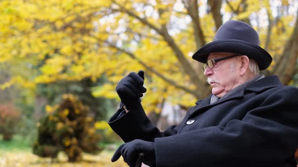 The Old Man Calls His Friend to Him with a Wave of His Hand