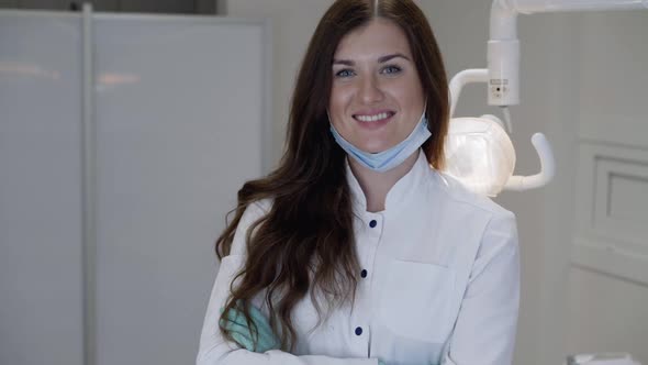 Portrait of Successful Female Dentist Smiling at Camera in Dentistry Clinic