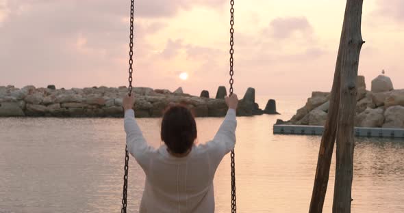 Woman on Beach During Sunset