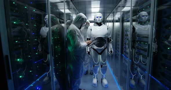 Engineers Testing on Robot Controls Inside the Laboratory