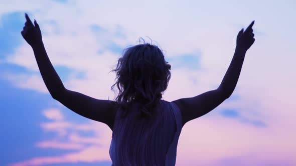 Blond Woman Raising Hands Looking at Sky, Freedom Feeling, Success, Dreams