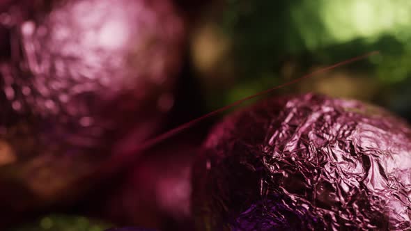 Rotating shot of colorful Easter candies on a bed of easter grass - EASTER 244