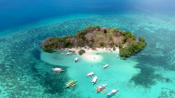 Wide aerial shot of CYC Island, Coron town, Philippines