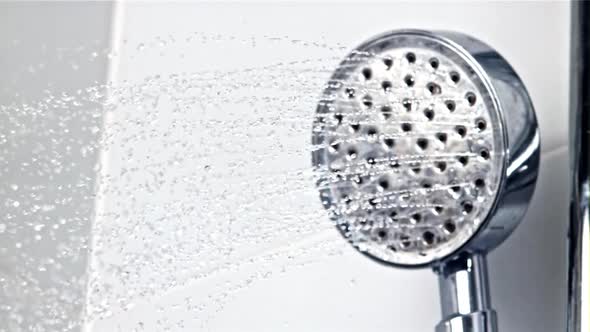 A Stream of Water Pours From the Shower Head