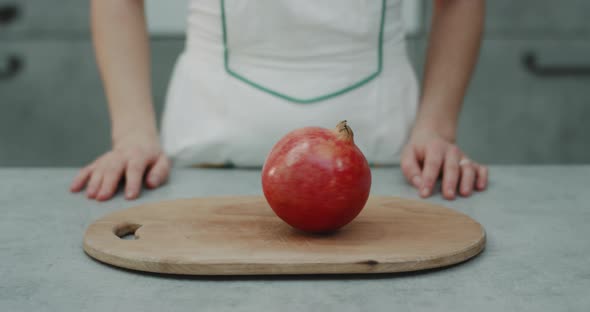 Slow Motion of a Pomegranate Portrait on the Wood