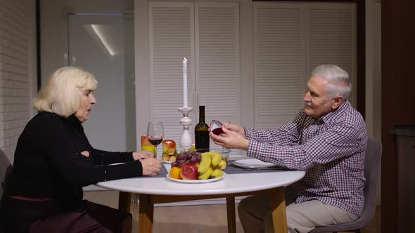 Senior Man Asking for Marriage His Grandmother Girlfriend. Grandfather Making Proposal in Kitchen