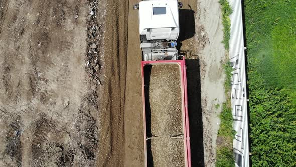 Construction of the road. Dump truck movement.