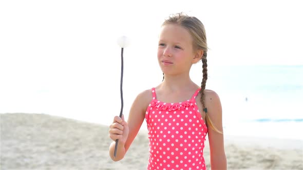 Adorable Little Girl at Beach Having a Lot of Fun. SLOW MOTION