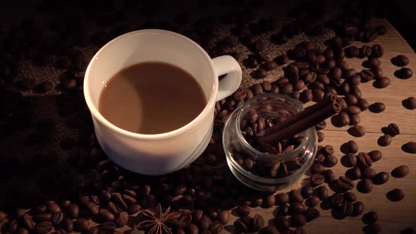 Coffee Beans, Cup, with Star Anise and Cinnamon on Sackcloth, Cam Moves To the Right, Shadow