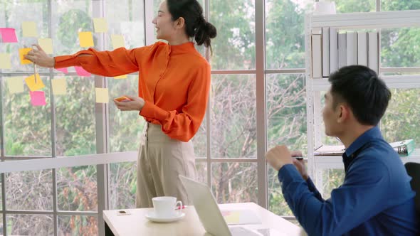 Business People Work on Project Planning Board