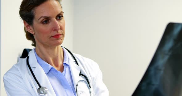 Female doctor examining an x-ray