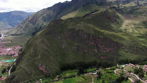 Scenic View Of Sacred Valley Towering Over Pisac Town In Cusco, Peru. Aerial Drone Shot