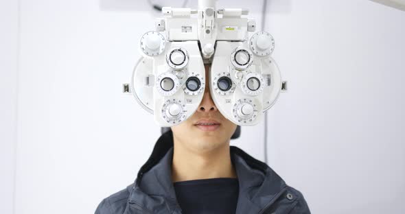 Man checking on eye in clinic