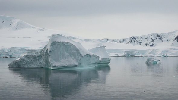 Icebergs and glaciers in Antarctica. Global Climate changes - the glaciers are warming and mellting.