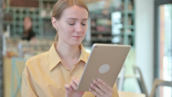 Portrait of Young Woman Using Digital Tablet 