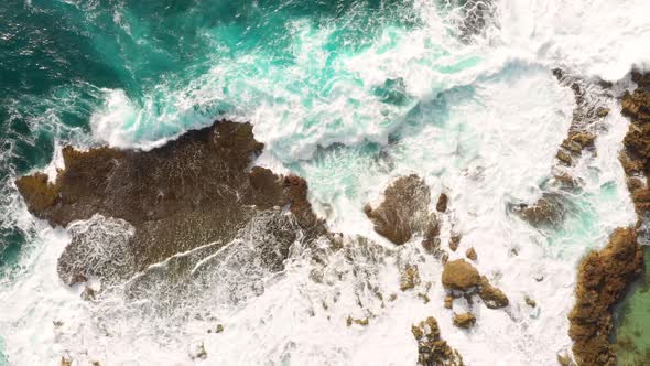 waves lapping rocks