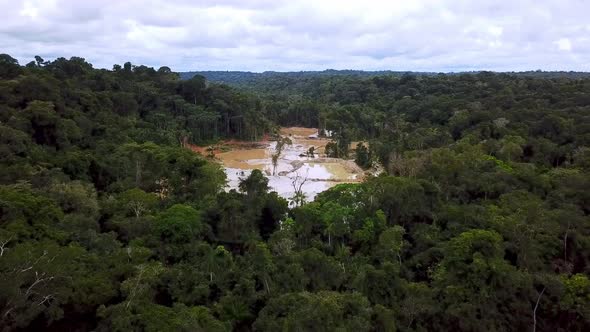 Drone video reveals an illegal gold mining area in the middle of the Amazon rainforest.