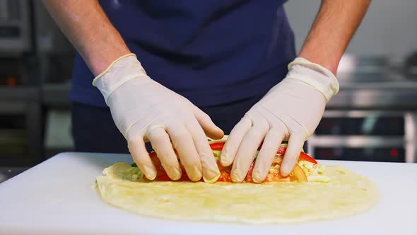 Process of cooking shawarma. Chicken shawarma cooking in restaurant kitchen