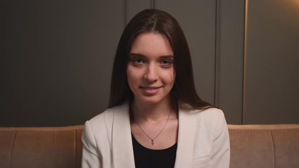 Confident Smiling Young Woman Looking at Camera Standing at Home Office