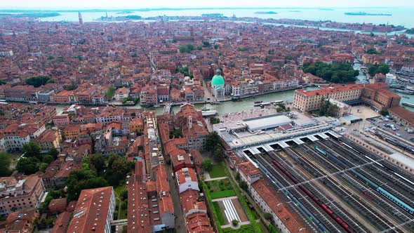 Flying Over Famous City Of Venice By The Grand Canal In Italy. Venezia Santa Lucia Train Station And