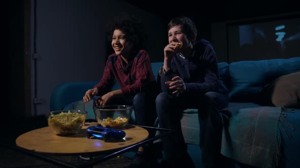 Laughing Boys Eating Popcorn and Watching Comedy