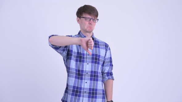Angry Young Hipster Man Giving Thumbs Down