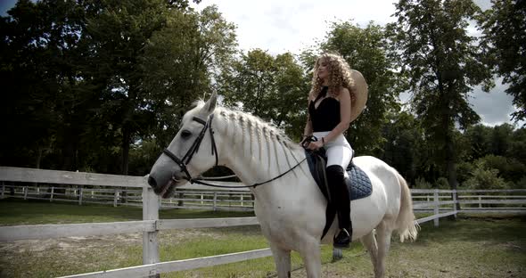 Beautiful Girl Saddled A White Horse