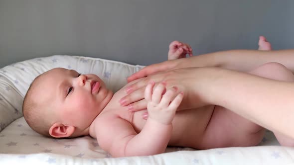 Mother Giving Massage To Little Child