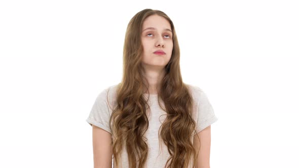 Portrait of Serious Young Woman Wearing Basic Tshirt Shaking Head in Refusal and Answering No or