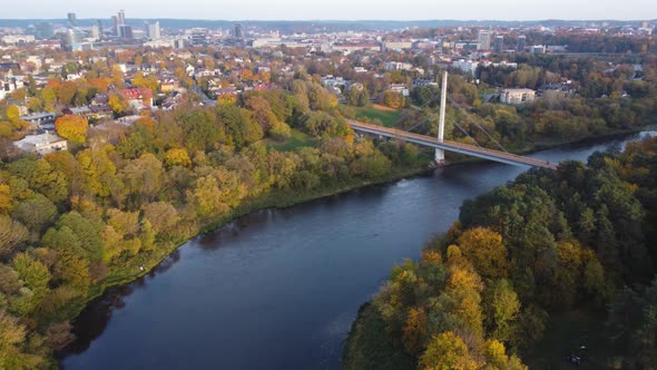 AERIAL Orbiting Shot of a Suburban Neighborhood Žvėrynas in Vilnius, Lithuania with a River Meanderi