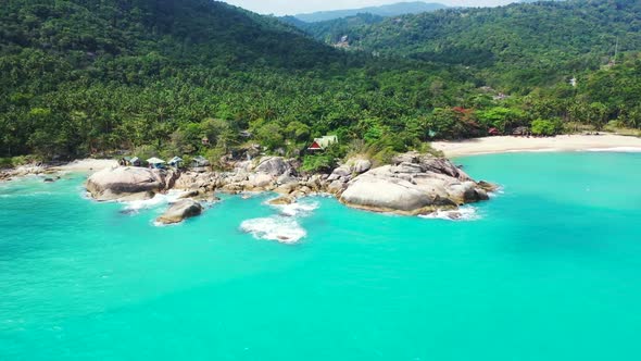 Aerial sky of tranquil coastline beach time by turquoise ocean with white sand background of adventu