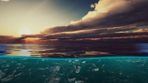 Split View Over and Under Water in the Caribbean Sea with Clouds