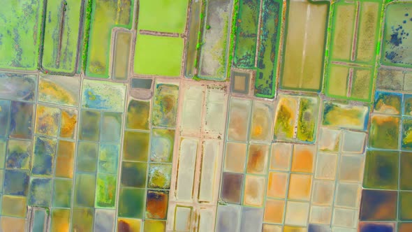 An aerial view from a drone flying over a salt fields, salt production.