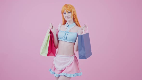 Cute Caucasian Shopaholic Teenager Posing with Bags Full of Goods Bought on Sale Medium Long Studio