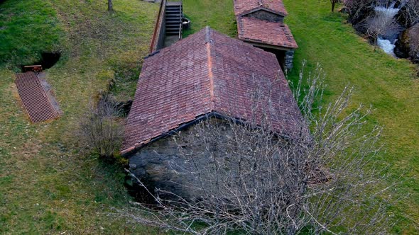 Slow Tilt Up Over Old Traditional Clay Roofing Tiles On Abandoned Buildings Tordoia Coruna, Spain