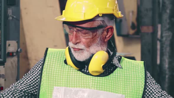 Smart Factory Worker Using Machine in Factory Workshop