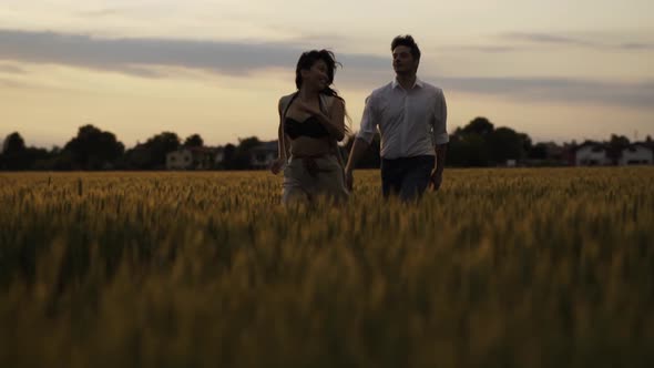 Slow motion shot of couple dancing outdoors in the evening