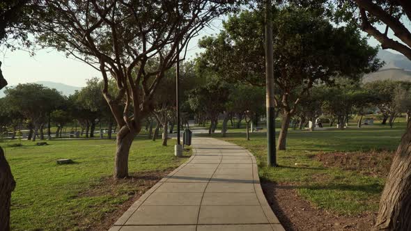 Stabilized walking shot through a public park in El Sol de la Molina, Lima, Peru