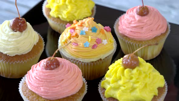 Beautifully Decorated Cupcakes with Cherry