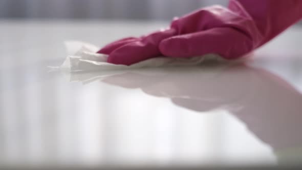 Woman Cleaning and Polishing the Kitchen Worktop with a Spray Detergent Housekeeping and Hygiene