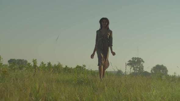 Joyful Pretty African American Woman Enjoying Nature and Running on Field