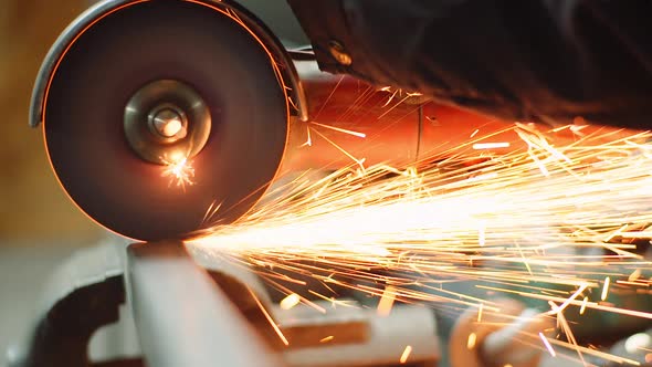 Industry Worker Grinding Metal with Angle Grinder