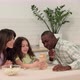 Cheerful Family of Different Races Play Board Game at Home - VideoHive Item for Sale