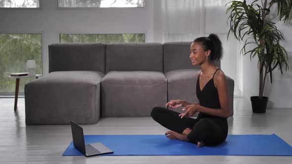 Woman Yoga Trainer Talking with Client Via Webcam