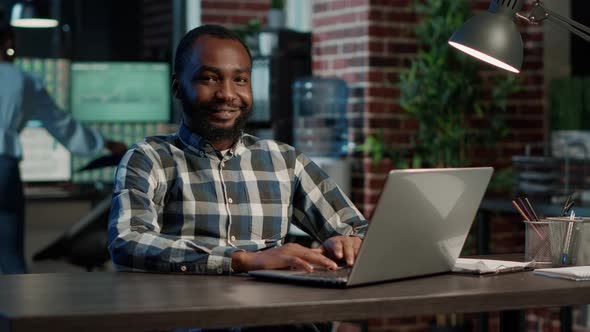 Portrait of Male Consultant Working on Stock Trade Sales